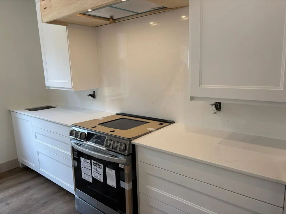 Countertop and full-height backsplash just installed