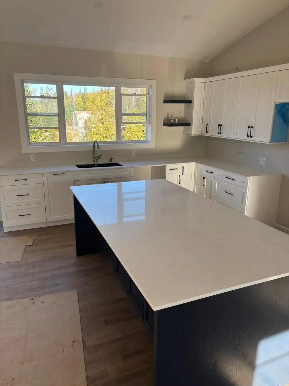 White countertop island on a navy base in a new build