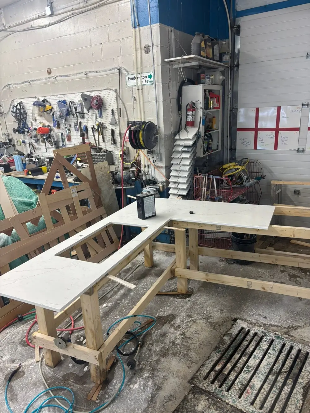 L-shaped countertop with a sink cutout in the shop